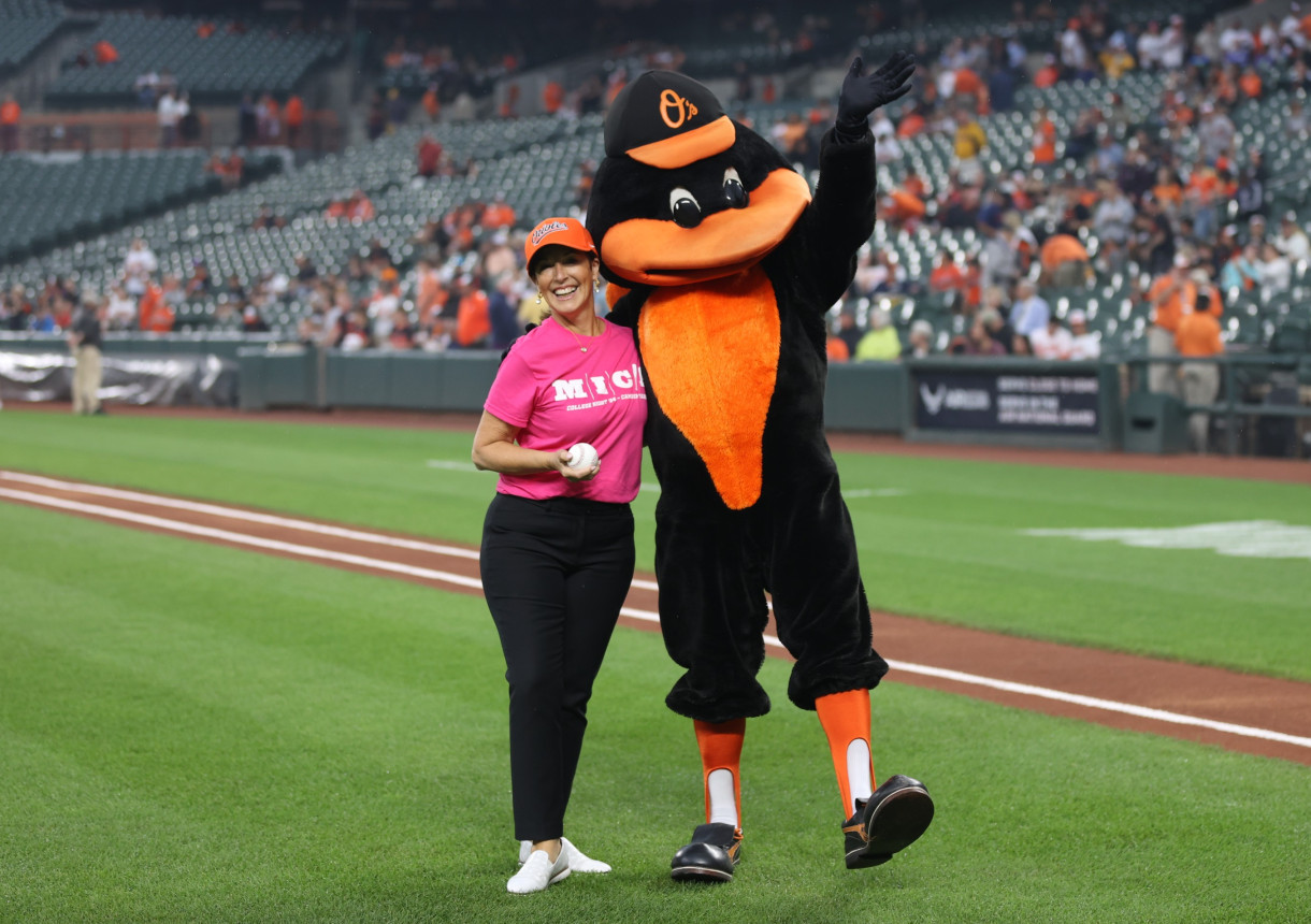 President McCormick with the offi cial mascot of the Baltimore Orioles, the Oriole Bird.