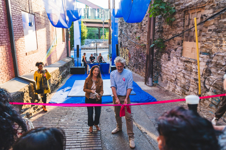 MICA president Cecilia McCormick and Lee Davis at the ribbon cutting portion of the gallery alley Opening Event.