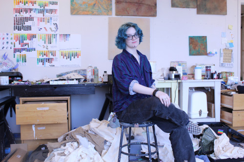 Portrait of Sam Weible '26  (LeRoy E. Hoffberger School of Painting MFA) in their studio.